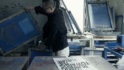 Fashion designers screen t-shirt, working at workspace Stock Footage