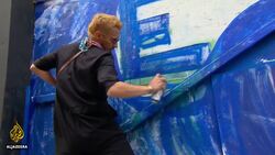 NYC artists display BLM street art on boarded-up storefronts News Clip