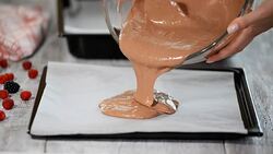 Pouring cake batter onto baking sheet. Making Chocolate Layer Cake. Series. Stock Footage
