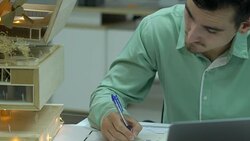 Architects are working on a building model at modern office. Designer are developing architecture. concept of construction, development and creative idea. Stock Footage