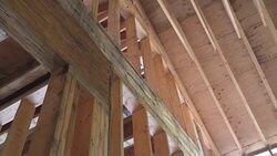 Wood framing work in progress with wood framing walls and ceiling or floor joist on a new construction building Stock Footage