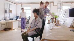 Time lapse serene creative businesswoman meditating with headphones in open office Stock Footage