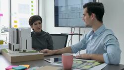 Architects male and Businesswoman are working on a building model. Business woman suggest idea to designer at modern office. concept of construction, architecture, development and creative. Stock Footage