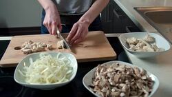 Woman cutting chicken meat Stock Footage