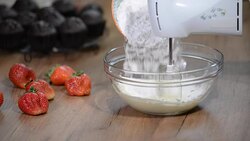 Beating butter. Making butter cream filling. Add powdered sugar to butter cream. Stock Footage