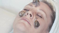 snail slime the secret of skin rejuvenation and female beauty Stock Footage