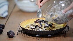 Cooking pie with plums. Delicious homemade plum pie. Stock Footage