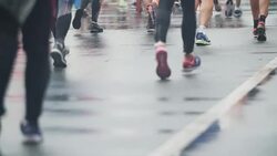 Crowded marathon in bad weather conditions Stock Footage