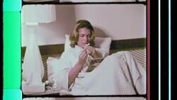 Girl reads magazine and smokes in bed, 1960s Stock Footage