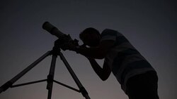 Man looking through a telescope. Stock Footage