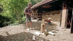 Man splitting logs for firewood Stock Footage