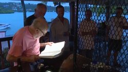 CLEAN : With a tot and a toast, Antigua's loyalists remain true to Charles News Clip