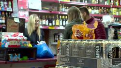 Sequence showing a Polish corner shop in Corby Stock Footage