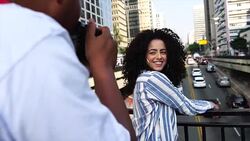 Young women posing to the photographer at avenida paulista, sao paulo, brazil Stock Footage