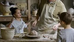 Potter Teaching Kids How to Work with Clay Stock Footage