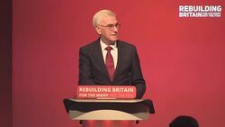 John McDonnell takes to the stage at the Labour Party Conference Stock Footage