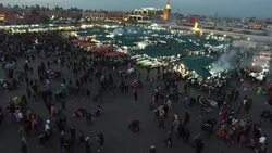Evening Djemaa El Fna Square with Koutoubia Mosque, Marrakech, Morocco Stock Footage