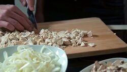 Couple cutting chicken meat Stock Footage
