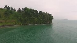 Enchanting turquoise sea waves washing green hills, inviting to relax, tourism Stock Footage