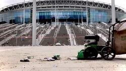 Staff cleaning litter outside Wembley stadium News Clip