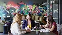 Businesswomen making strategies in office cafe Stock Footage