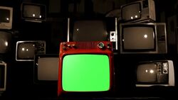 Old Red Tv Green Screen In The Middle Of Many Tvs. Bad Signal. Sepia Tone. Stock Footage