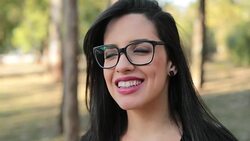 Young brunette woman wearing feminist glasses with a happy look expression on face looking camera smiling Stock Footage