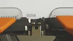 Close up footage of a person writing CORRUPTION on an old typewriter, with sound Stock Footage