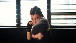 beautiful young moving boxing woman training punching in fitness studio Stock Footage