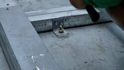 Young man working with hammer. Installation Lower base of prefabricated houses. video Slow Motion Stock Footage