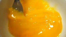 Stirring eggs in bowl for cooking, slow motion. Stock Footage