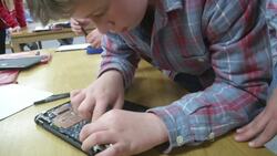 Student 'geek squads' trouble shoot classroom smart devices News Clip