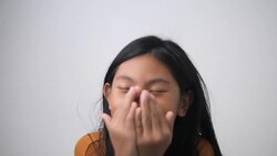 Asian girl sneezing while catch a cold, health concept. Stock Footage