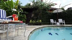Healthy fruit drinking on a table in an spa resort with pool in Bali Stock Footage