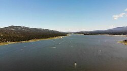 Aerial Shot Flying Sideways Across Big Bear Lake on a Busy Boating Summer Day Stock Footage