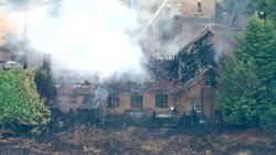 Wildfire spreads to a house in Runnymede News Clip
