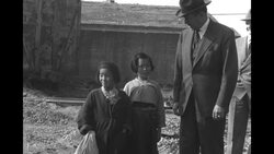 Economic Cooperation Administration head Foster with orphan girls while on inspection tour of South Korea during Korean War News Clip