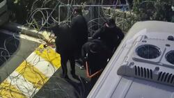 Police cut through barbed wire to arrest impeached South Korean president News Clip