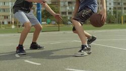 Young man on basketball court dribbling with ball Stock Footage
