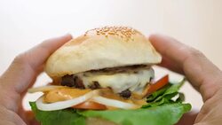 FPV grab and biting hamburger. Stock Footage