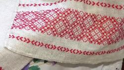 National red and white embroidery. The process of decorating decorative towels embroidered red ornament. Stock Footage