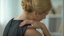 Secretary suffering shoulder nerve inflammation, feeling strong pain, back view Stock Footage