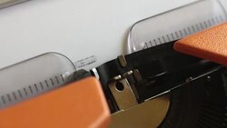 Close up footage of a person writing WORLD WAR III on an old typewriter Stock Footage