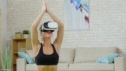 Woman Enjoying Yoga in VR Goggles Stock Footage