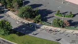 RUNNING RACE - DRONE SHOT - RUNNERS SPREAD OUT AND DRONE MOVES WITH THEM Stock Footage