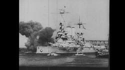 World War II Battleship Fires at Shore and Explosions Stock Footage