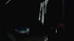 Illicit drug trafficking, man in suit heavily paying for drug package near trunk Stock Footage