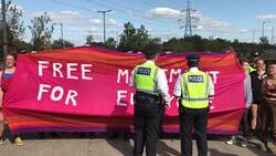 Police intervene as protesters block road outside London arms fair News Clip