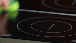 Cleaning induction cooktop Stock Footage