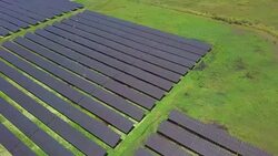 Solar Cell Aerial view flying over large solar farm clean renewable energy Stock Footage